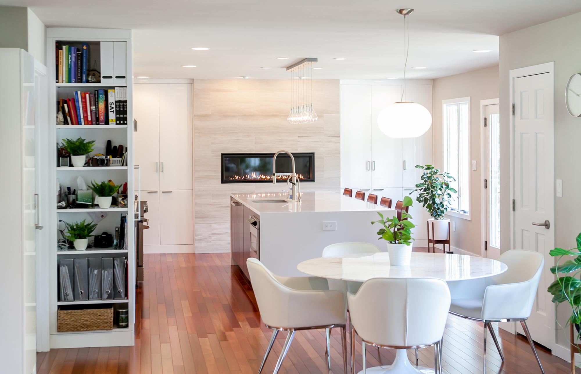 White furniture with bookshelf outside of kitchen